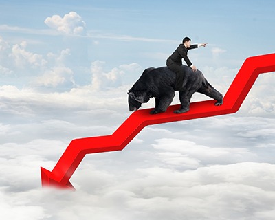 Businessman riding bear on arrow downward trend line with sky - Inflate or Die! Miller on the Money