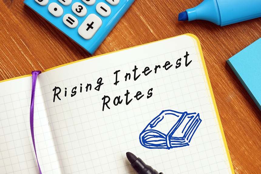 Business concept meaning Rising Interest Rates with sign on the page - Interest Rates Are Rising, So Now What? - Miller on the Money