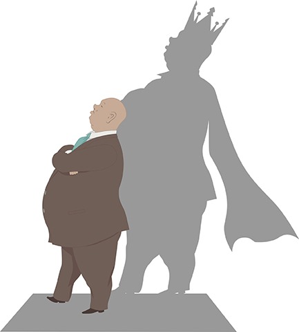 Business man standing with shadow of a king